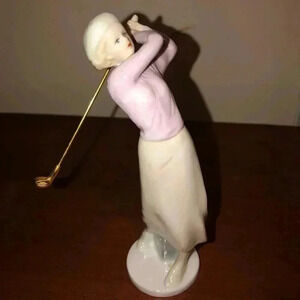 Lady golfer figurine